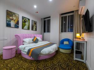 Postel nebo postele na pokoji v ubytování Shell Hotel Taixing Huangqiao Town Dinghui Road + 226 fotografií