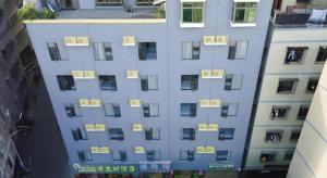 an overhead view of a building with signs on it at Vatica Hotel Haikou Jinniuling Park Haizhiyuan in Haikou +24 photos