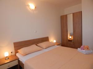 Postel nebo postele na pokoji v ubytování Apartments Sofija