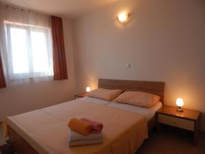 Postel nebo postele na pokoji v ubytování Apartments Sofija