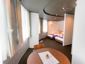 Postel nebo postele na pokoji v ubytování Hotel S-Presso Central - Vacation STAY 9443 + 3 fotografie