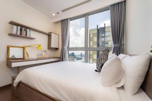 Postel nebo postele na pokoji v ubytování SunnyWave O-Stay Apartment