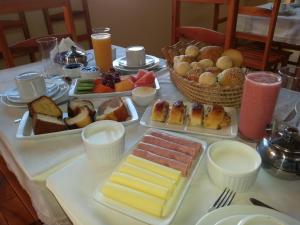 a table with many different types of food on it at Pousada Brisa Do Pontal in Fortim