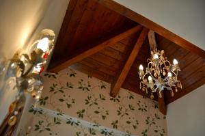 a chandelier is hanging from a wooden ceiling at Casa Montse in Torla-Ordesa