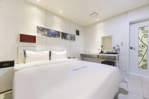 Η κουζίνα ή μικρή κουζίνα στο Yeosu Tiamo Hotel