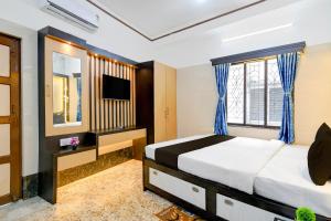 Ένα ή περισσότερα κρεβάτια σε δωμάτιο στο Super Hotel O Howrah Railway Station