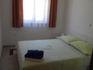 Postel nebo postele na pokoji v ubytování Apartments Sofija