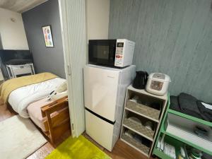 Η κουζίνα ή μικρή κουζίνα στο サイプレス平岸