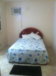 Cama ou camas em um quarto em Pousada Cibeles