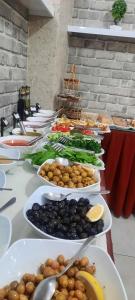 a buffet with plates of food on a table at Hotel seven park in Nevsehir +15 photos