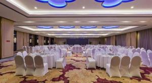 a large banquet hall with white tables and chairs at Palace Hotels Beijing Yongfeng Nan(S) Subway Station in Beijing