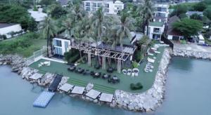 an aerial view of a resort on the water at Eco Moment Beach Resort in Ban Laem Phak Bia (1)