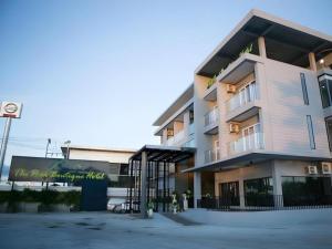 a large building with a sign in front of it at The Peak Boutique Hotel in Ban Hua Mi Na