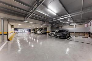 a large garage with cars parked in it at Hotel Primo Daejeon in Daejeon