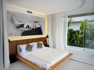 Ένα ή περισσότερα κρεβάτια σε δωμάτιο στο Baliwood - Ocean View Lovina +18 φωτογραφίες