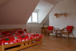 A bed or beds in a room at Penzion Conti