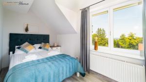 Ένα ή περισσότερα κρεβάτια σε δωμάτιο στο Apartamenty z balkonami, spokojna okolica