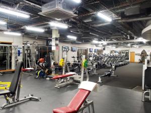 a gym with a lot of equipment in a room at Abbey Court in Nenagh