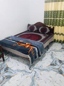 a bed sitting on top of a marble floor at Holiday Guest in Nuwara Eliya in Nuwara Eliya