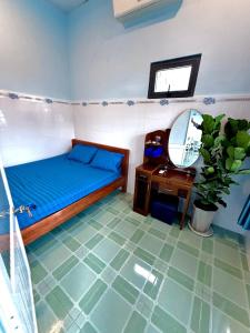 Postel nebo postele na pokoji v ubytování Nhà xanh Homestay + 7 fotografií