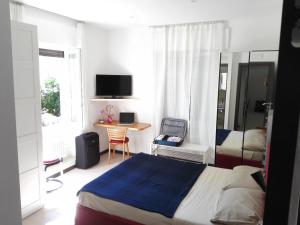 TV a/nebo společenská místnost v ubytování B&B Rosa Blu