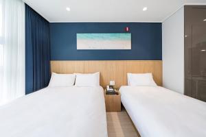 Ένα ή περισσότερα κρεβάτια σε δωμάτιο στο Stay More Residence Dongtan