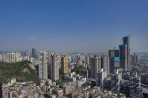 a view of a city with tall buildings at GreenTree Alliance Hotel Guiyang Huaguo Community Central Business Zone in Guiyang