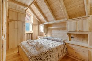 Postel nebo postele na pokoji v ubytování Baita Delle Stelle - Happy Rentals