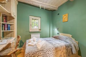 Postel nebo postele na pokoji v ubytování Baita Delle Stelle - Happy Rentals