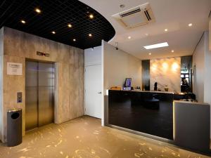 an office with a lobby with a door and a counter at The Keong Saik Hotel in Singapore