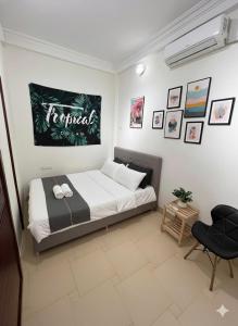 a bedroom with a bed and a chair in it at NOOK INN Hidden Gem Old Quarter in Hanoi