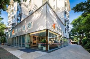 a store front of a building with glass windows at UHotelPhoenixInternationalAirport in Sanya