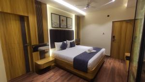 Ένα ή περισσότερα κρεβάτια σε δωμάτιο στο Sivashree Residency