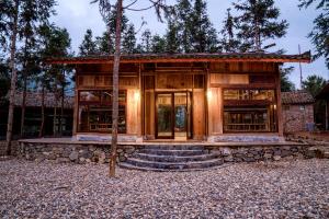a house in the middle of a forest at Balana HaGiang in Làng Lap