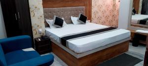 Voodi või voodid majutusasutuse Collection O Digha Ghat Formerly Hotel Shahnai toas