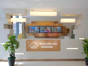 a sign for a greenridge line in a building at GreenTree Inn Suzhou Changshu North Haiyu Road Changhui Square Express Hotel in Changshu