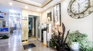 a room with a large clock on the wall at Ace Hotel in To-dong