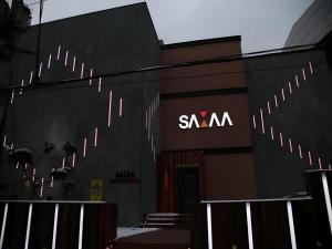 a svm building with a sign on the side of it at Some Motel in Suwŏn-yŏk