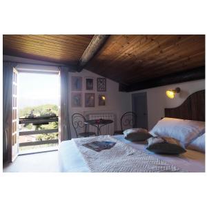 Postel nebo postele na pokoji v ubytování Locanda Il Rustichello