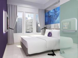 TV a/nebo společenská místnost v ubytování G Suites Hotel By AMITHYA