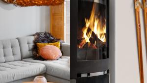 a fireplace in a living room with a couch at Fjellvangvegen 11 by Vacation Trysil in Trysil