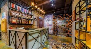 a bar in a room with a brick wall at Shang Pin Holiday Inn in Guangzhou
