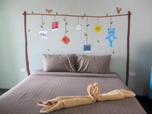 Postel nebo postele na pokoji v ubytování The Palm Village