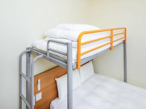 Giường trong phòng chung tại Comfort Inn Tsuchiura Ami