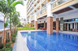 a swimming pool in the middle of a building at Mango Sea View Hotel in Sanya