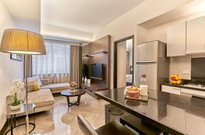 a kitchen and living room in a apartment at Orchard Scotts Residences by Far East Hospitality in Singapore