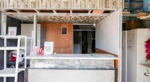 a building with a counter in the middle of a room at OYO 94024 Sentraland karawang By Aswin in Poponcal 2 +117 photos