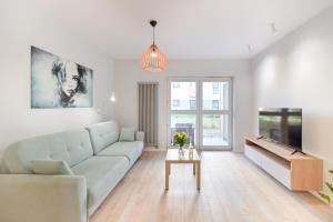 Posezení v ubytování Apartament pistacjowy z parkingiem