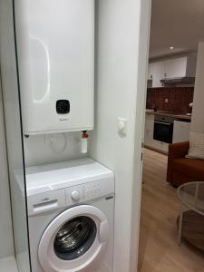 a washer and dryer in a living room at Appartement Chic 4 personnes - Plein Centre Historique in Angers