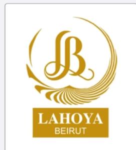 Ein Logo für ein Restaurant mit einem Buchstaben B und einer Feder in der Unterkunft Lahoya Beirut in Beirut